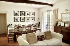 Living room with access to the river terrace and view to the forest